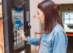 Girl Buying from Vending Machine